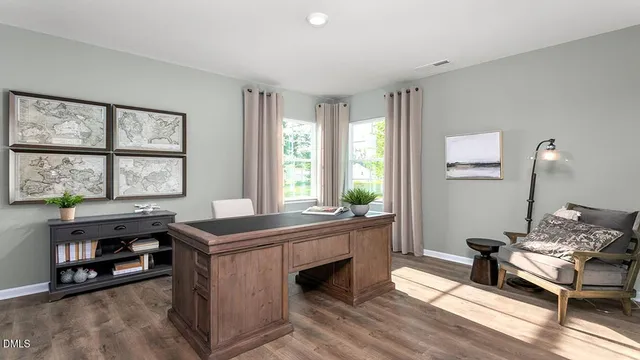 a kitchen with stainless steel appliances granite countertop a sink stove microwave and refrigerator