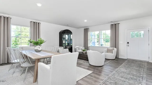 a view of a dining room with furniture and window