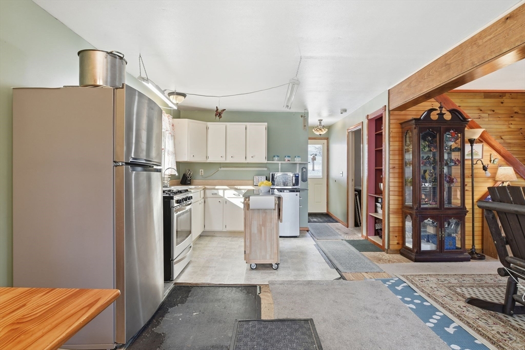200 Fox Den Road Tolland, MA 01034 - Photo 17 of 37 a kitchen with stainless steel appliances a refrigerator and a stove