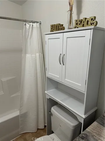 a bathroom with a shower and a sink