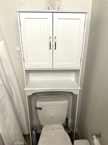 a bathroom with a toilet and a sink
