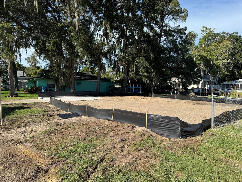 7206 Bethesda Court Weeki Wachee, FL 34607 - Photo 2 of 7 a view of a yard with wooden fence