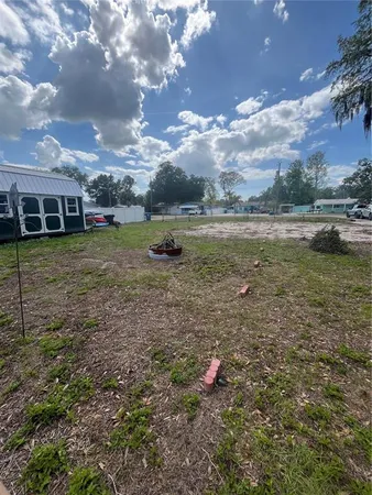 a view of a lake with a yard