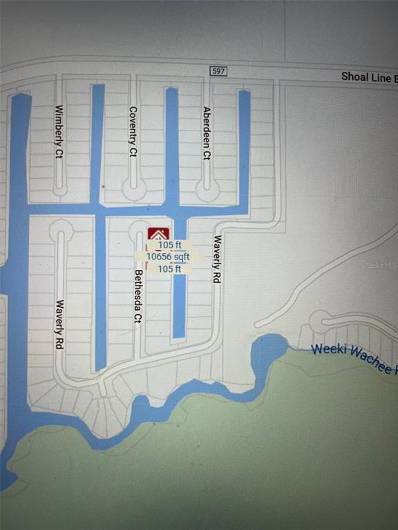 7206 Bethesda Court Weeki Wachee, FL 34607 - Photo 7 of 7 a white bath tub sitting in a bathroom