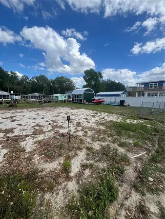 a view of a lake with houses in the back