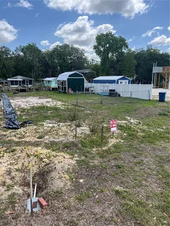 a view of a swimming pool with a yard