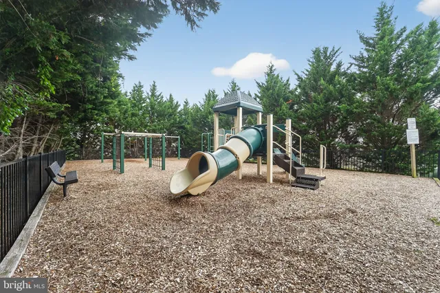 a view of a backyard with sitting area