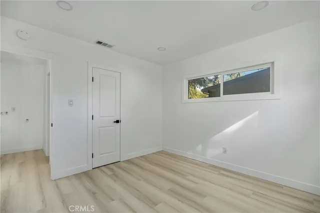 a view of room with wooden floor