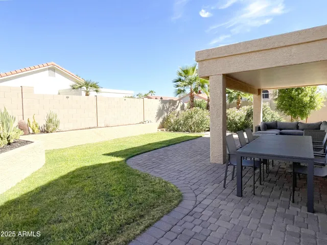 a backyard of a house with lots of green space