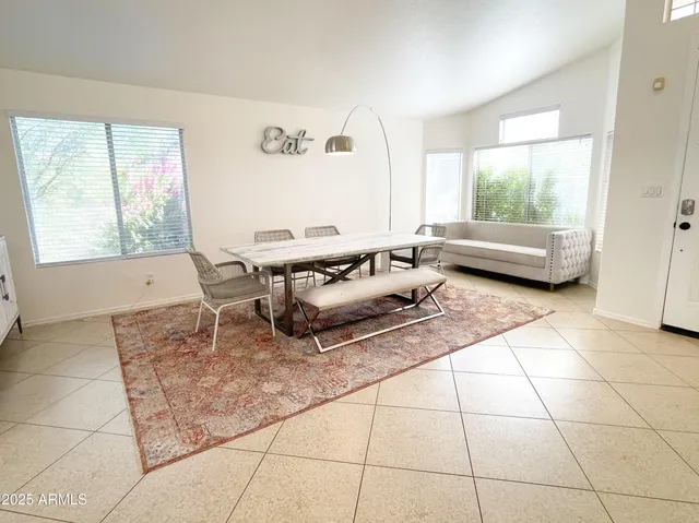 a living room with a bath tub and a window
