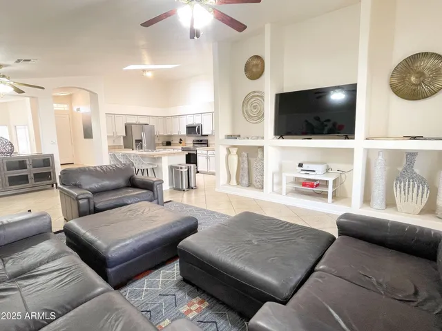 a kitchen with a refrigerator and a stove