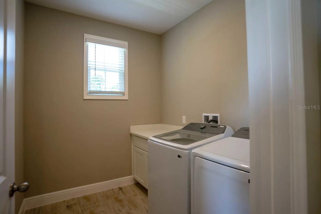 1676 Andover Rdg Drive DeLand, FL 32720 - Photo 14 of 14 a utility room with dryer and washer