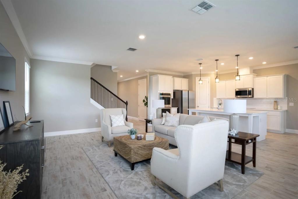 1676 Andover Rdg Drive DeLand, FL 32720 - Photo 6 of 14 a living room with furniture and kitchen view