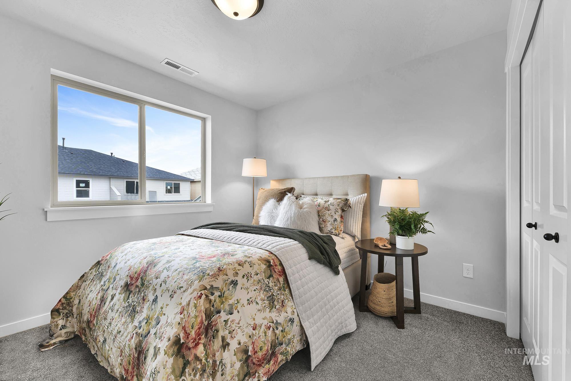 414 South Fritts Avenue Meridian, ID 83642 - Photo 11 of 21 Bedroom featuring carpet and a closet