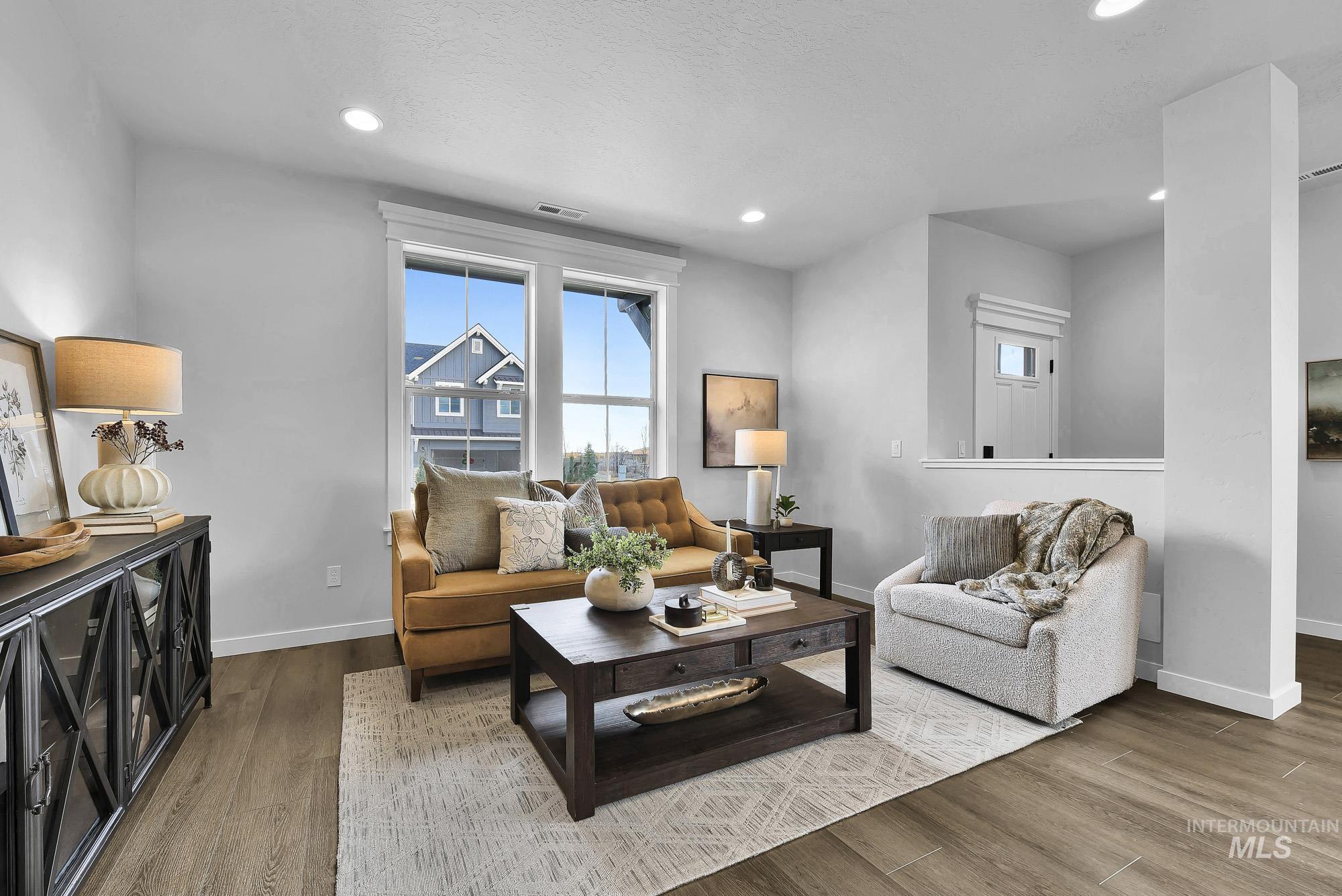 414 South Fritts Avenue Meridian, ID 83642 - Photo 5 of 21 Living room with wood finished floors and recessed lighting