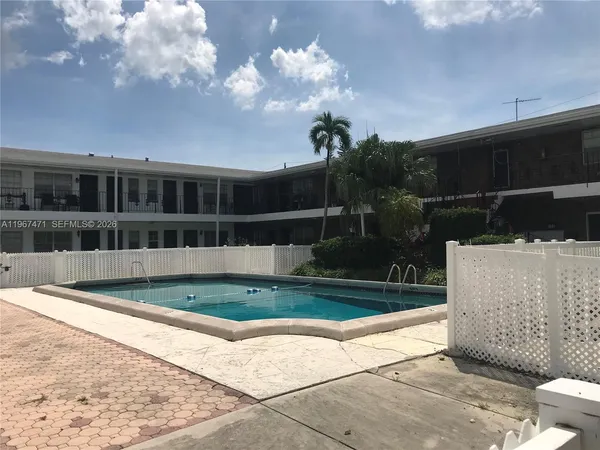 a view of house with yard