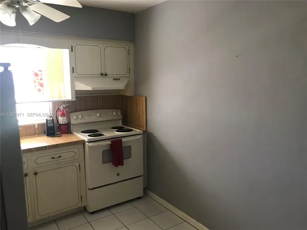 a kitchen with a stove and a sink