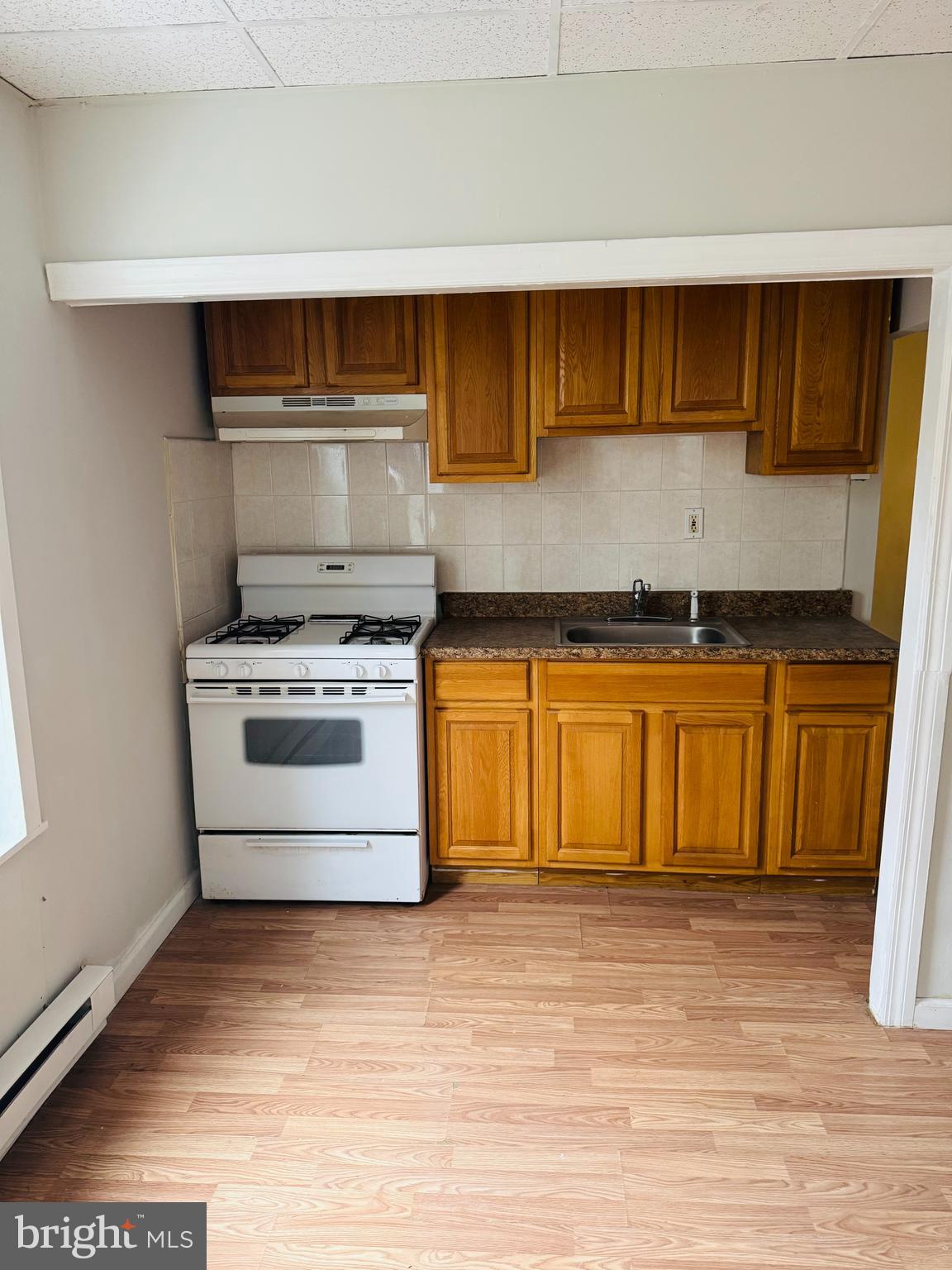 a kitchen with a stove and a sink
