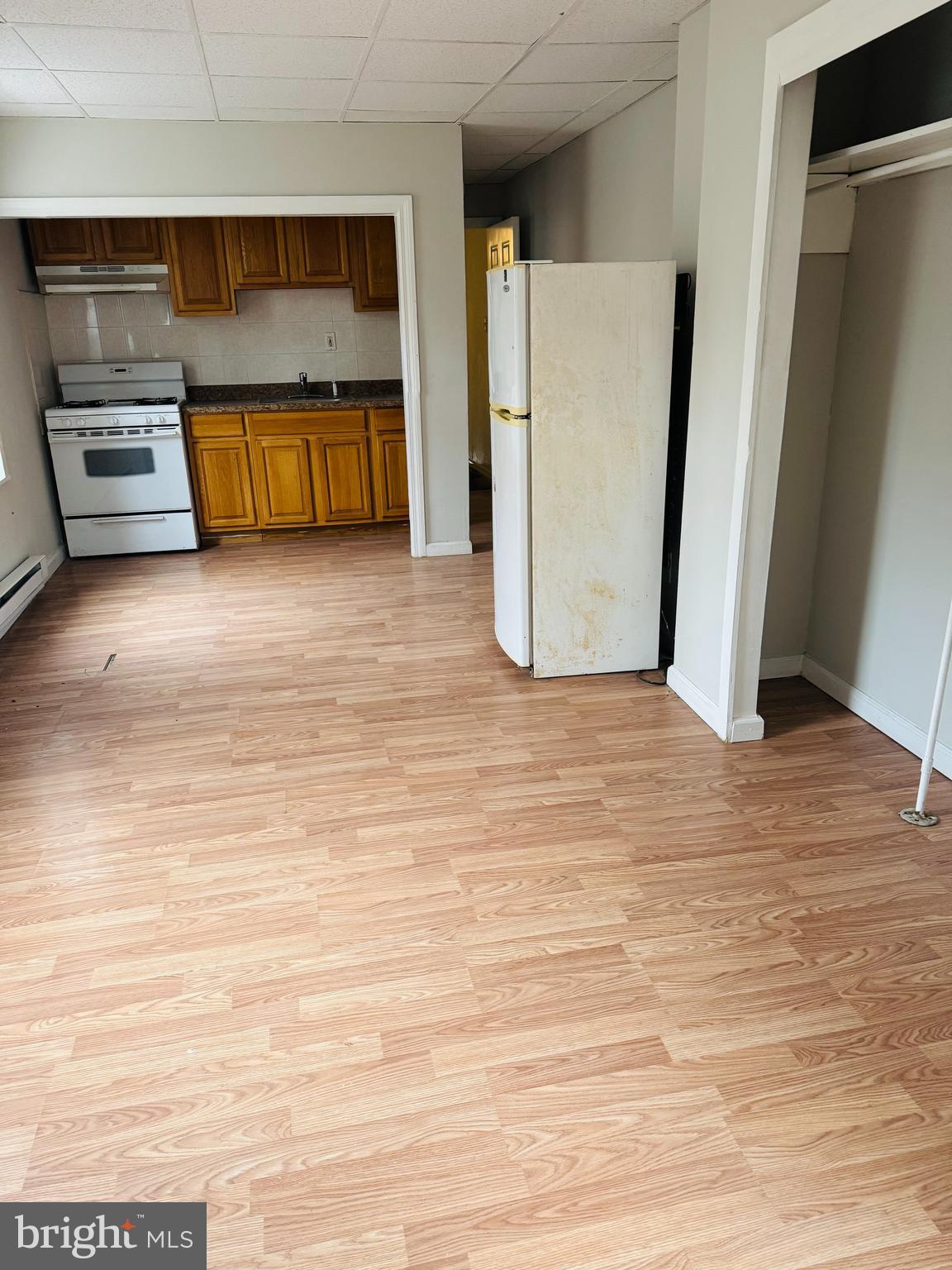 2037 North 8th Street, Unit 2R Philadelphia, PA 19122 - Photo 2 of 5 a bedroom with a bed and a walk in closet
