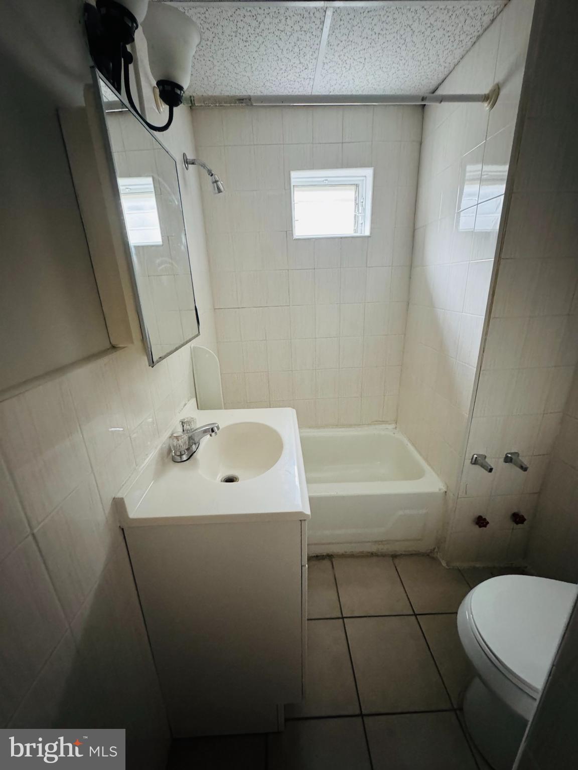 2037 North 8th Street, Unit 2R Philadelphia, PA 19122 - Photo 5 of 5 a bathroom with a sink a toilet and shower