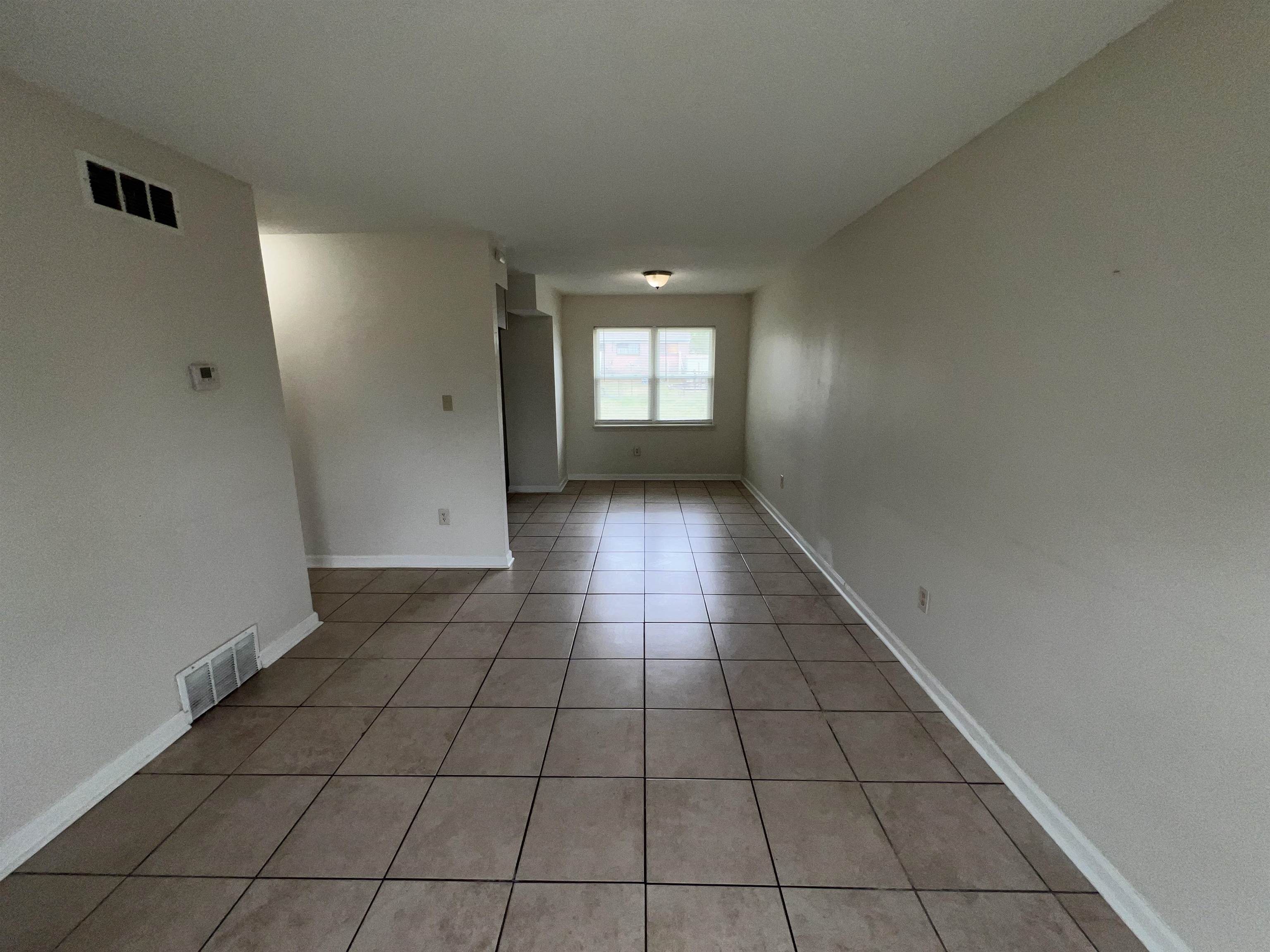 580 Blackhawk Road Memphis, TN 38109 - Photo 4 of 10 a view of an empty room with a window