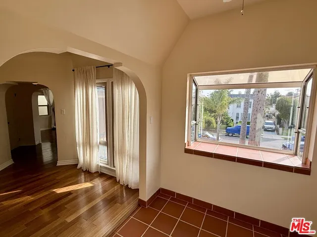 a kitchen with stainless steel appliances granite countertop a refrigerator a sink and a stove