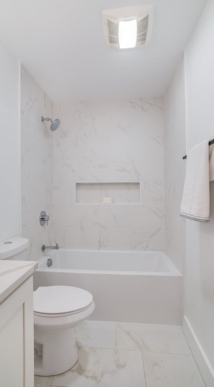 38 Chester Street, Unit 1 Somerville, MA 02144 - Photo 12 of 32 a bathroom with a toilet and a bathtub