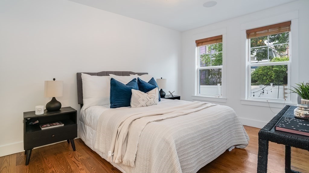 38 Chester Street, Unit 1 Somerville, MA 02144 - Photo 17 of 32 a bedroom with a bed and a window