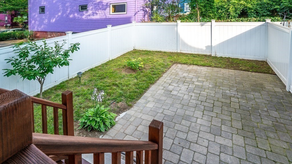 38 Chester Street, Unit 1 Somerville, MA 02144 - Photo 29 of 32 a view of a backyard with sitting area