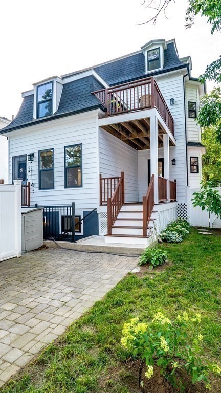 38 Chester Street, Unit 1 Somerville, MA 02144 - Photo 32 of 32 a front view of a house with garden