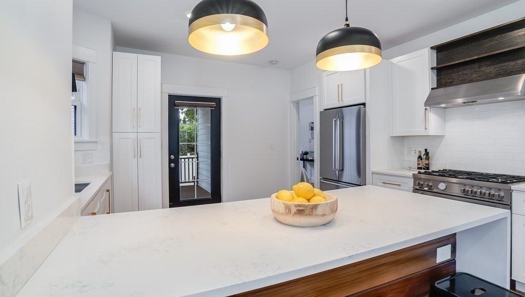38 Chester Street, Unit 1 Somerville, MA 02144 - Photo 8 of 32 a kitchen with a table and chairs