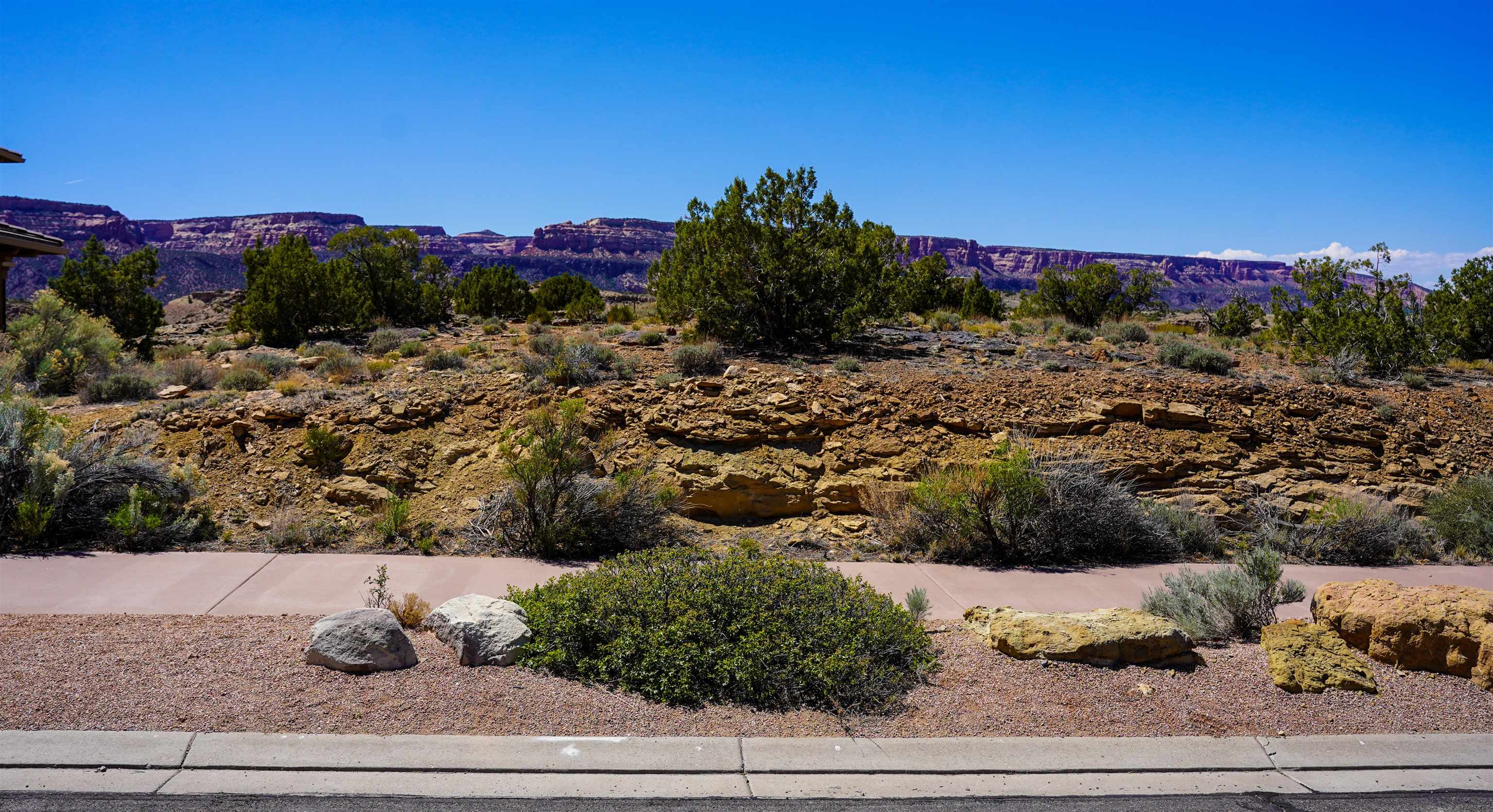 353 High Desert Road Grand Junction, CO 81507 - Photo 1 of 15 a view of a house with a garden