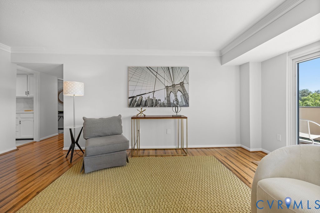 2956 Hathaway Road, Unit U704 Richmond, VA 23225 - Photo 13 of 42 Living area featuring wood-finish flooring, a neut