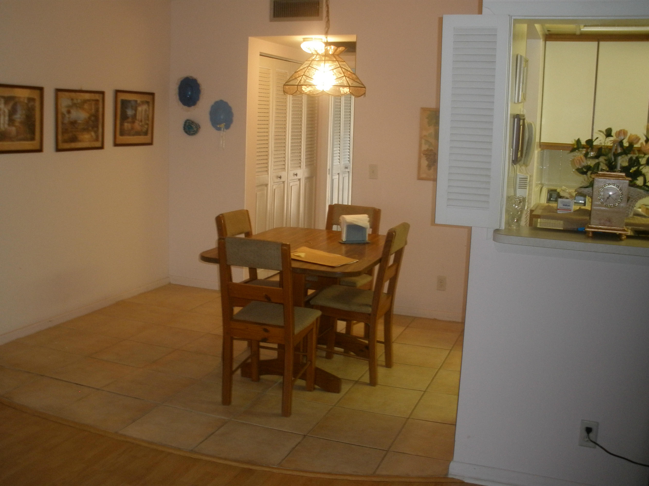 492 Mansfield K Boca Raton, FL 33434 - Photo 4 of 11 a view of a dining room with furniture and window