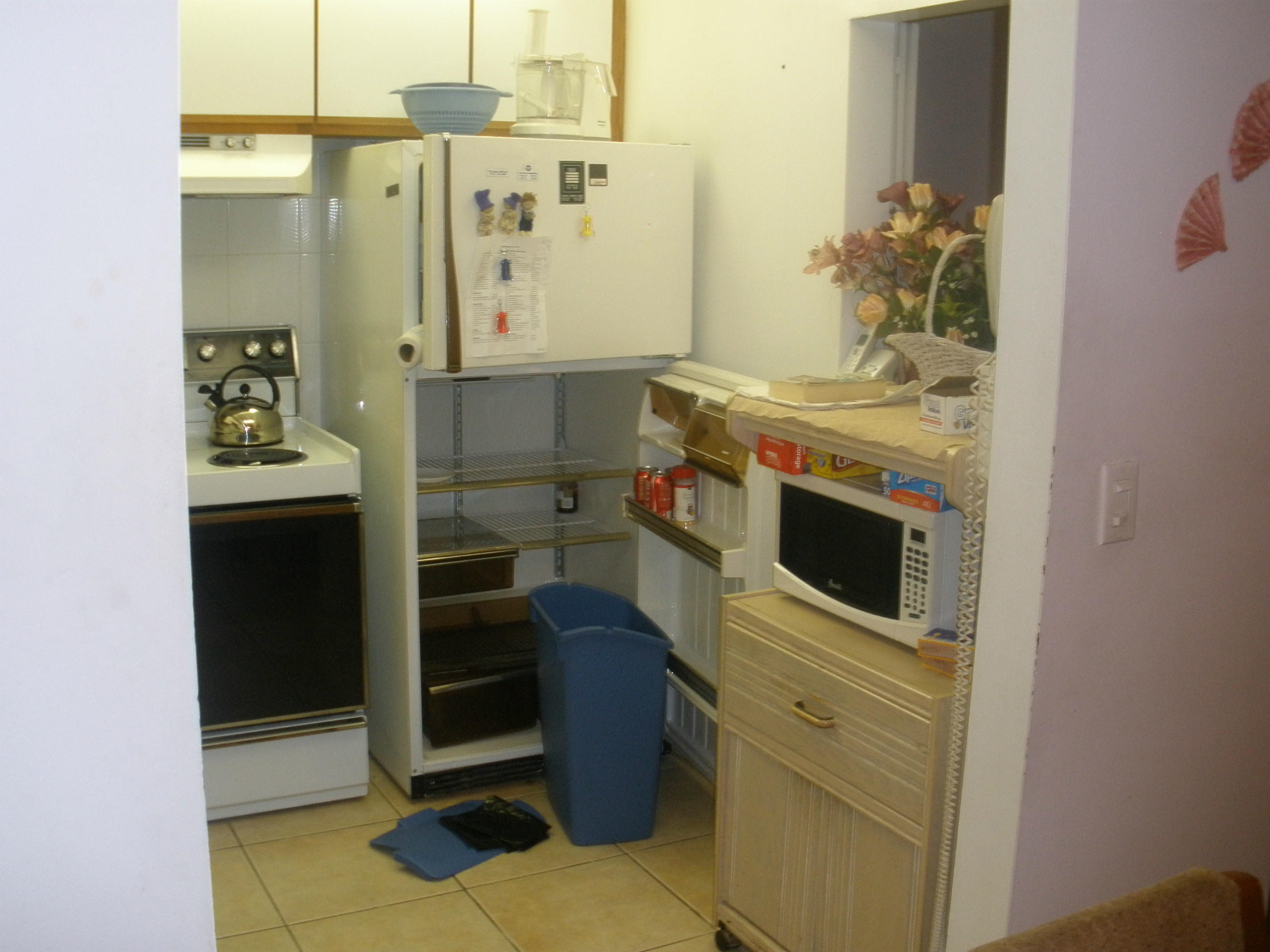 492 Mansfield K Boca Raton, FL 33434 - Photo 6 of 11 a bathroom with a sink and a mirror