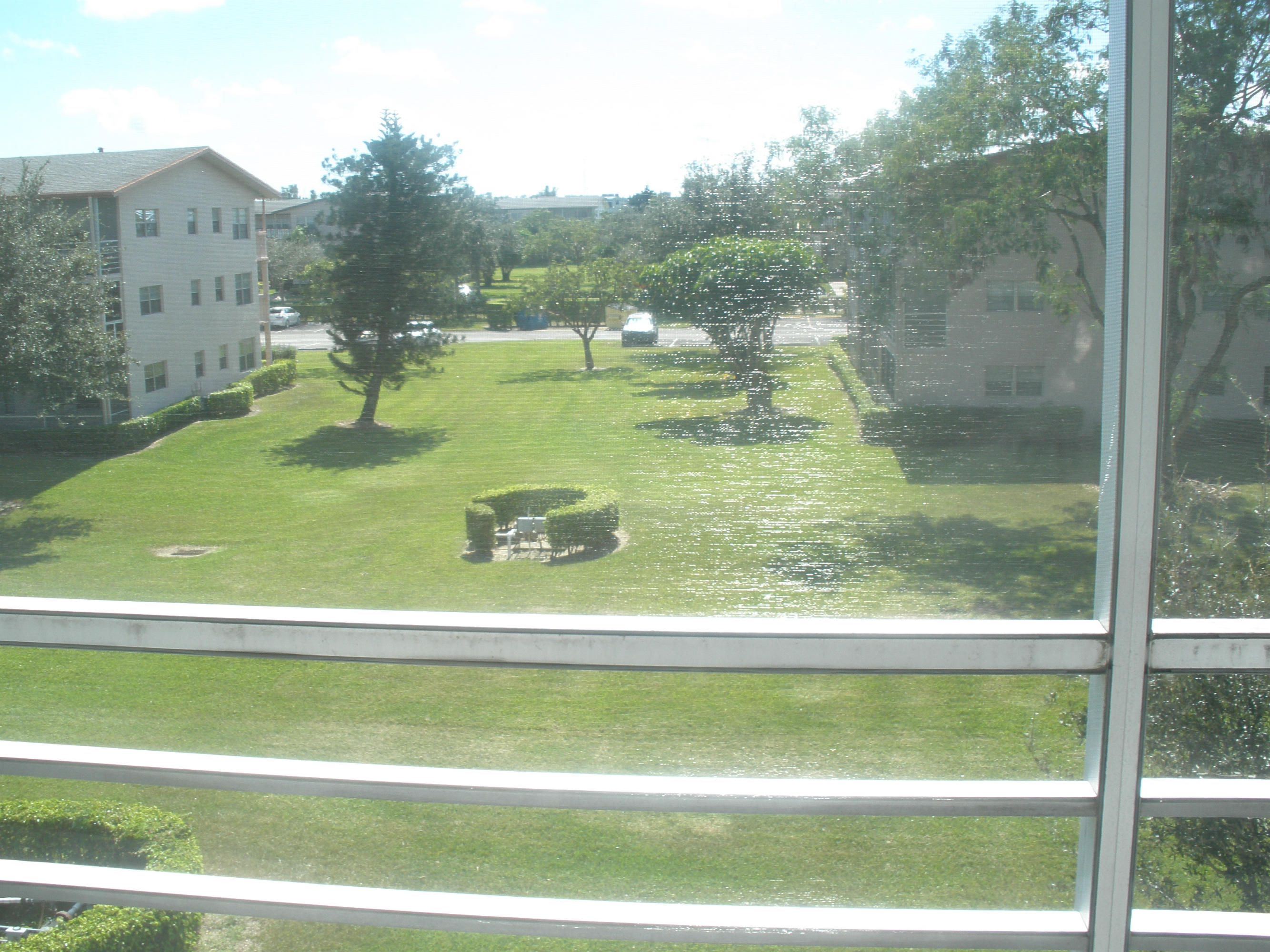 492 Mansfield K Boca Raton, FL 33434 - Photo 10 of 11 a view of a swimming pool with a yard