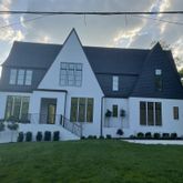 a view of house with yard