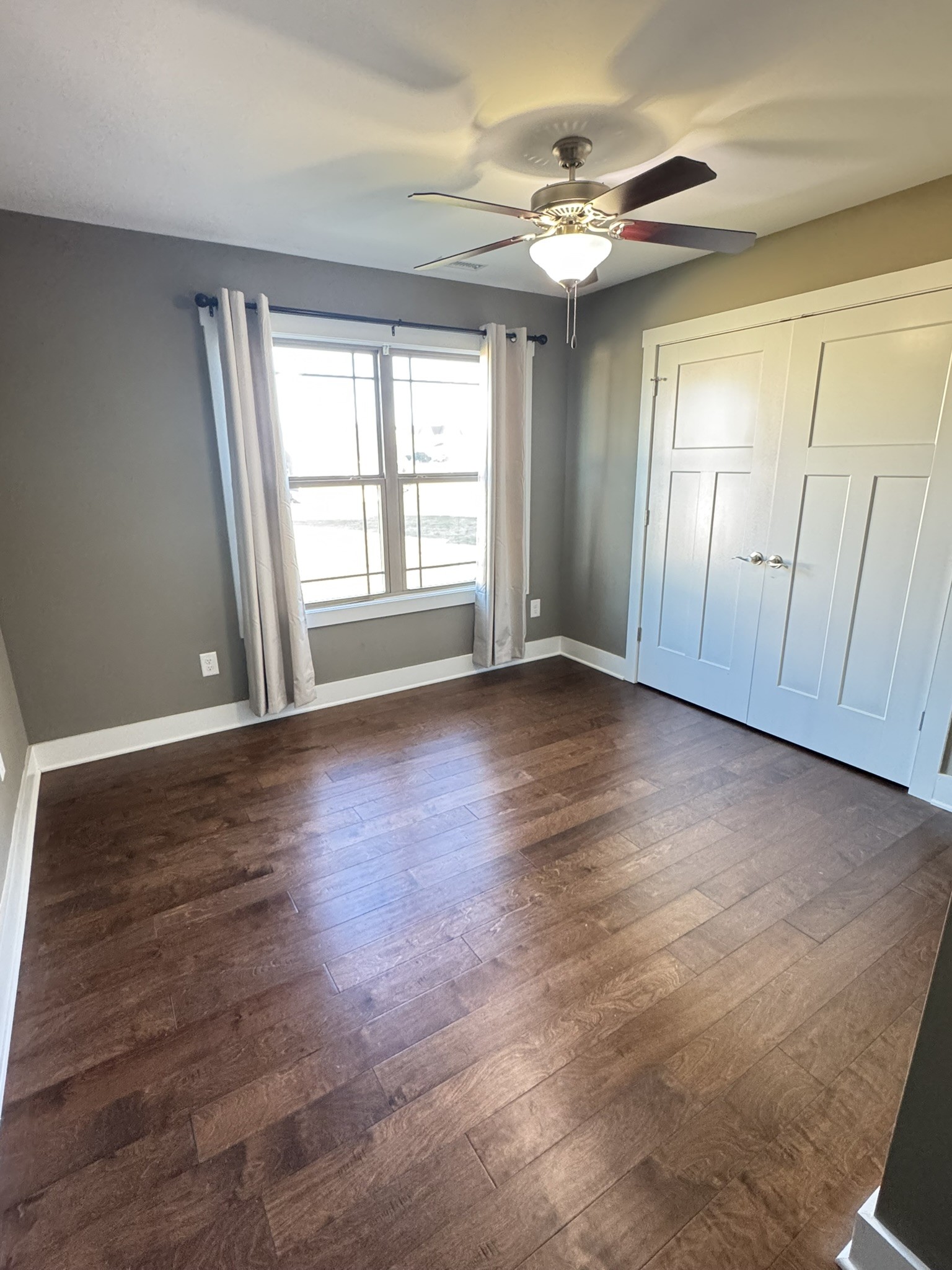148 ANDERTON Drive Winchester, TN 37398 - Photo 11 of 16 an empty room with wooden floor and windows