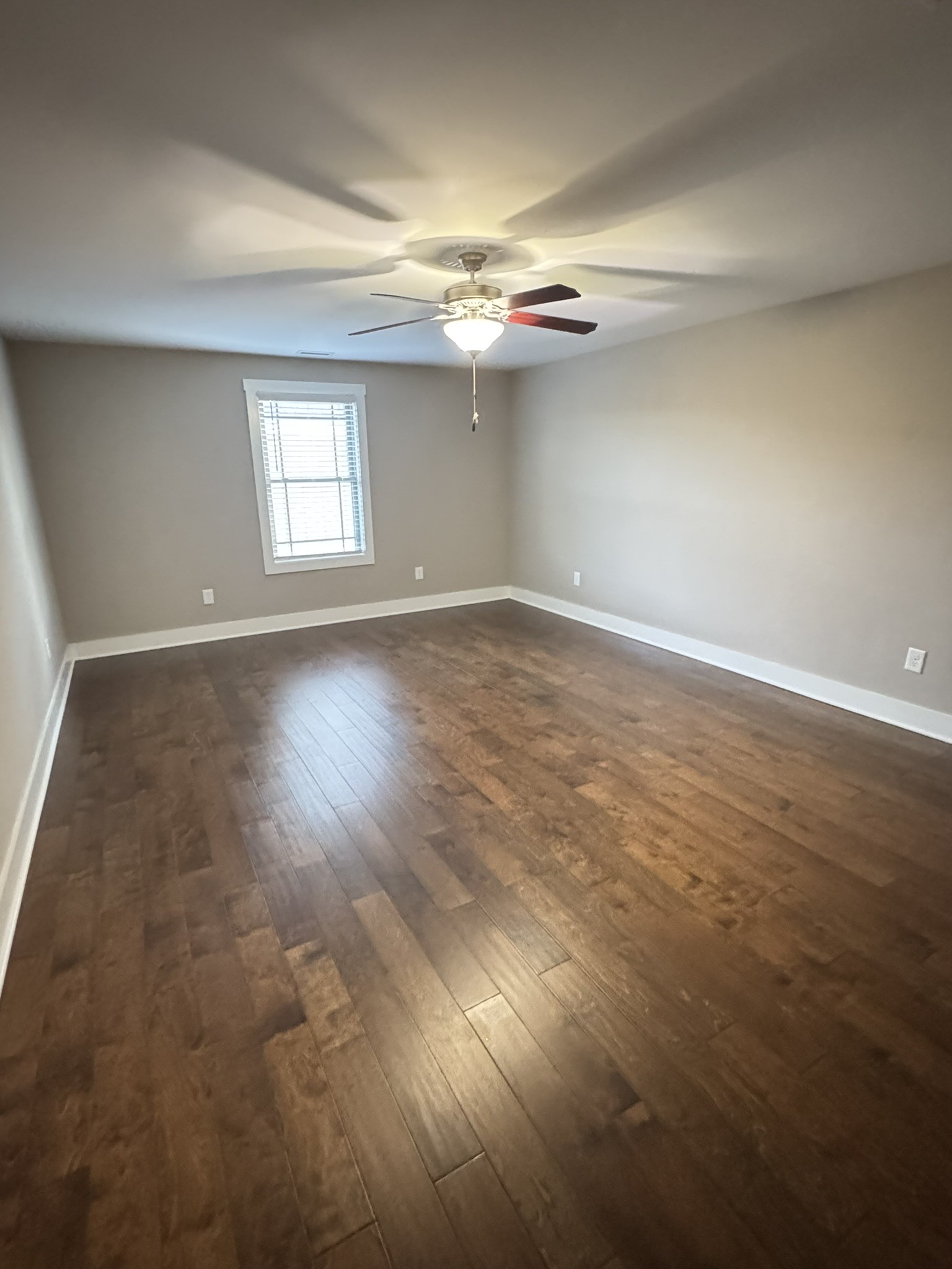 148 ANDERTON Drive Winchester, TN 37398 - Photo 13 of 16 an empty room with windows and chandelier fan