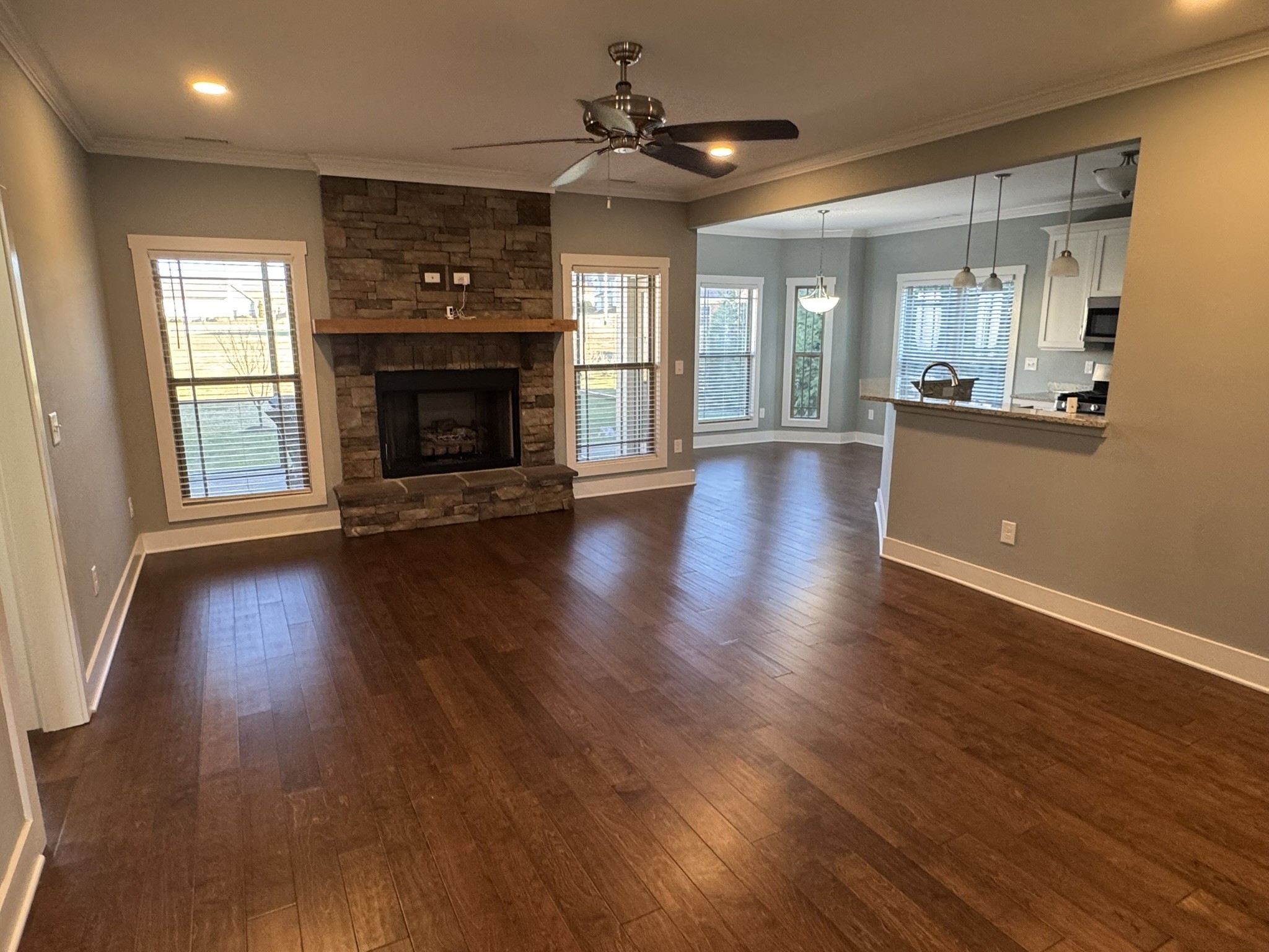 148 ANDERTON Drive Winchester, TN 37398 - Photo 2 of 16 an empty room with wooden floor and a fireplace