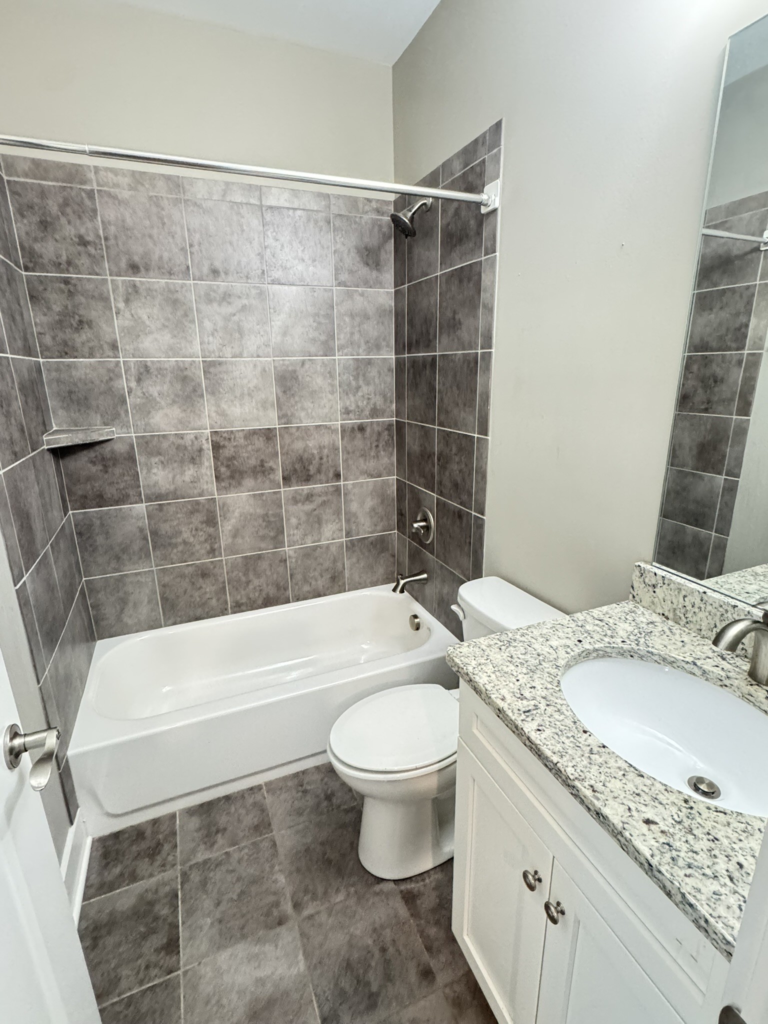 148 ANDERTON Drive Winchester, TN 37398 - Photo 9 of 16 a bathroom with a granite countertop toilet a sink and bathtub