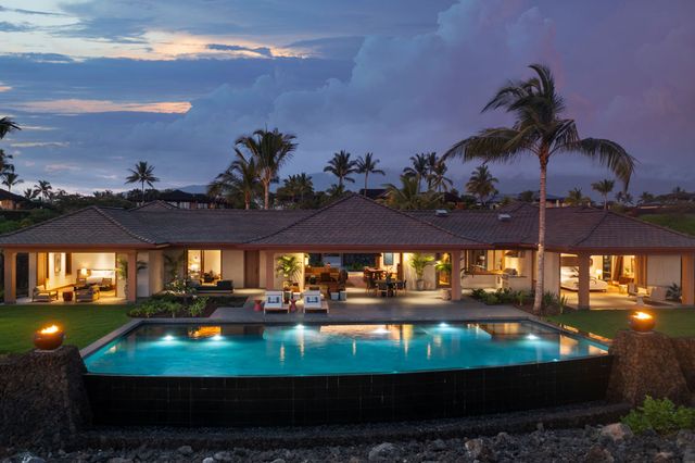a view of a swimming pool with an outdoor seating
