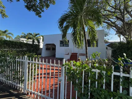 a house view with a garden space