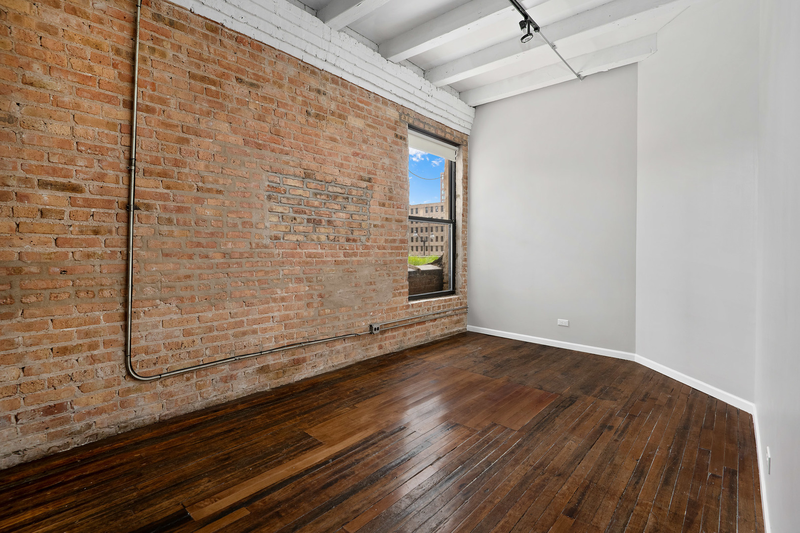 1012 West Randolph Street, Unit 3 Chicago, IL 60607 - Photo 6 of 8 a view of a room with wooden floor