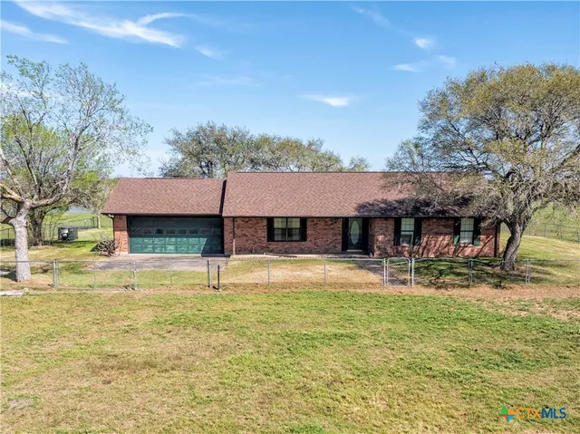 a view of a lake with a yard