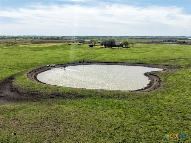 a view of a lake with a big yard