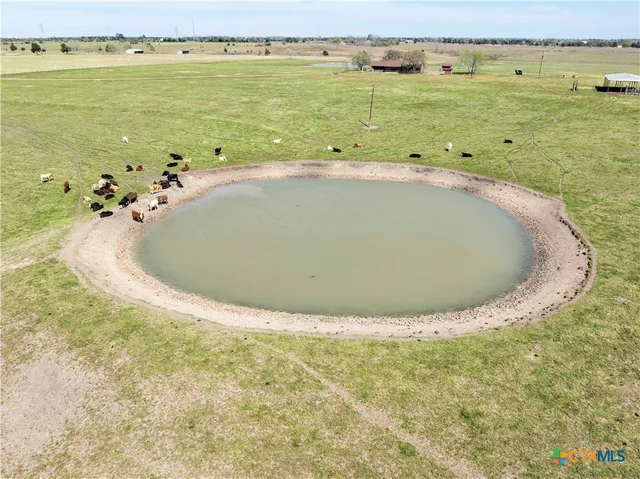 a swimming pool with lawn chairs