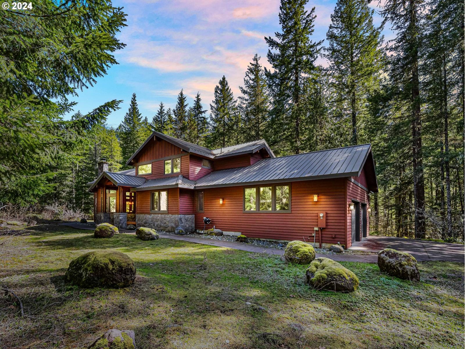 20803 East Glacier View Road Rhododendron, OR 97049 - Photo 1 of 48 a front view of a house with garden