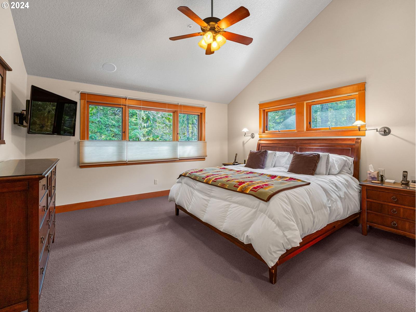 20803 East Glacier View Road Rhododendron, OR 97049 - Photo 25 of 48 a bedroom with a bed and a flat screen tv