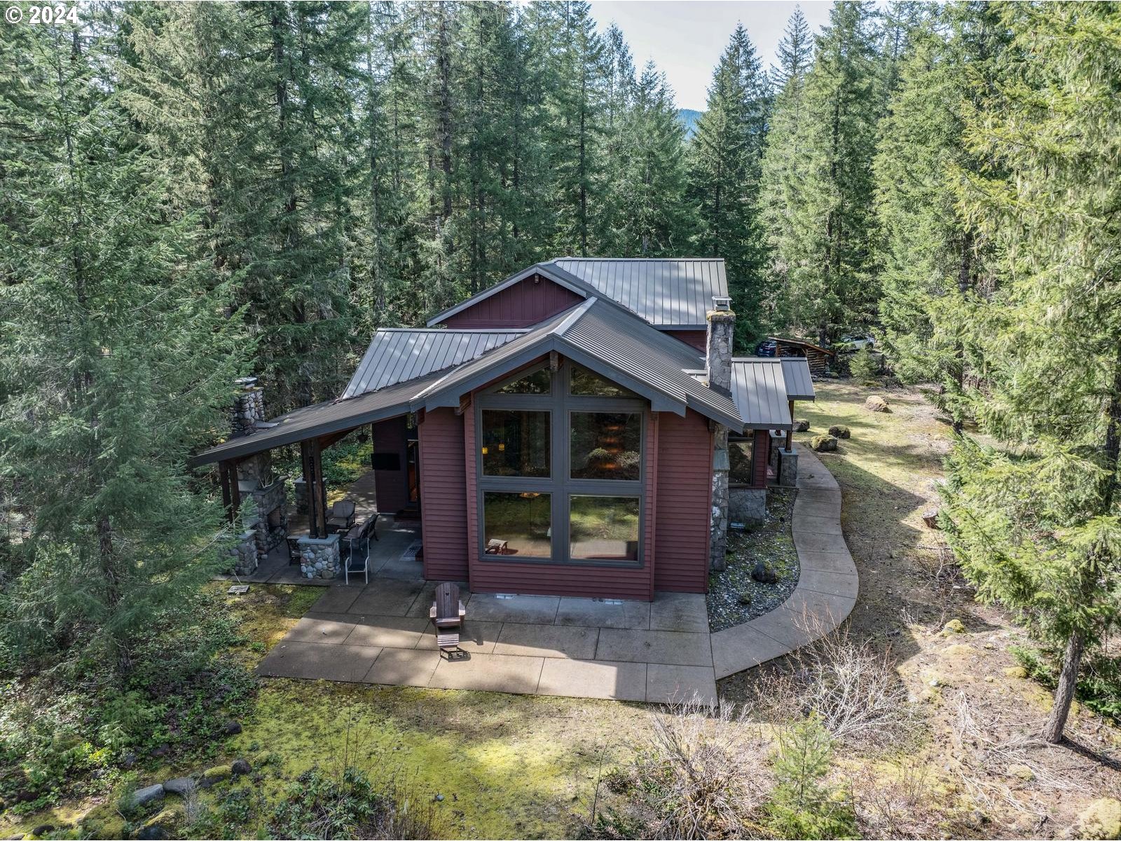 20803 East Glacier View Road Rhododendron, OR 97049 - Photo 40 of 48 a view of house with yard entertaining space and wooden fence